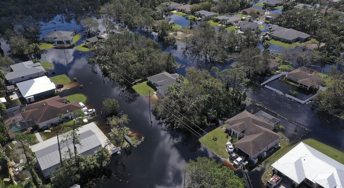 In this aerial view, a neighborhood flooded by the rising Myakka River is shown in the wake of Hurricane Ian on October 01, 2022 in North Port, Florida.