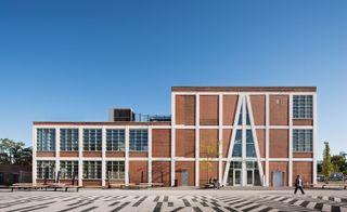 Red brick building with geometric paving