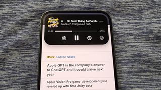 iPhone 14 Pro Dynamic Island showing podcast playing