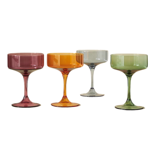 An assorted set of colored coupe glasses