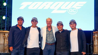 Torque GC team members pose for a photo with Greg Norman