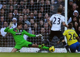 Tim Krul the Newcastle United goalkeeper makes a save under pressure from Christian Eriksen of Tottenham Hotspur during the Barclays Premier League match between Tottenham Hotspur and Newcastle United at White Hart Lane on November 10, 2013 in London, England.