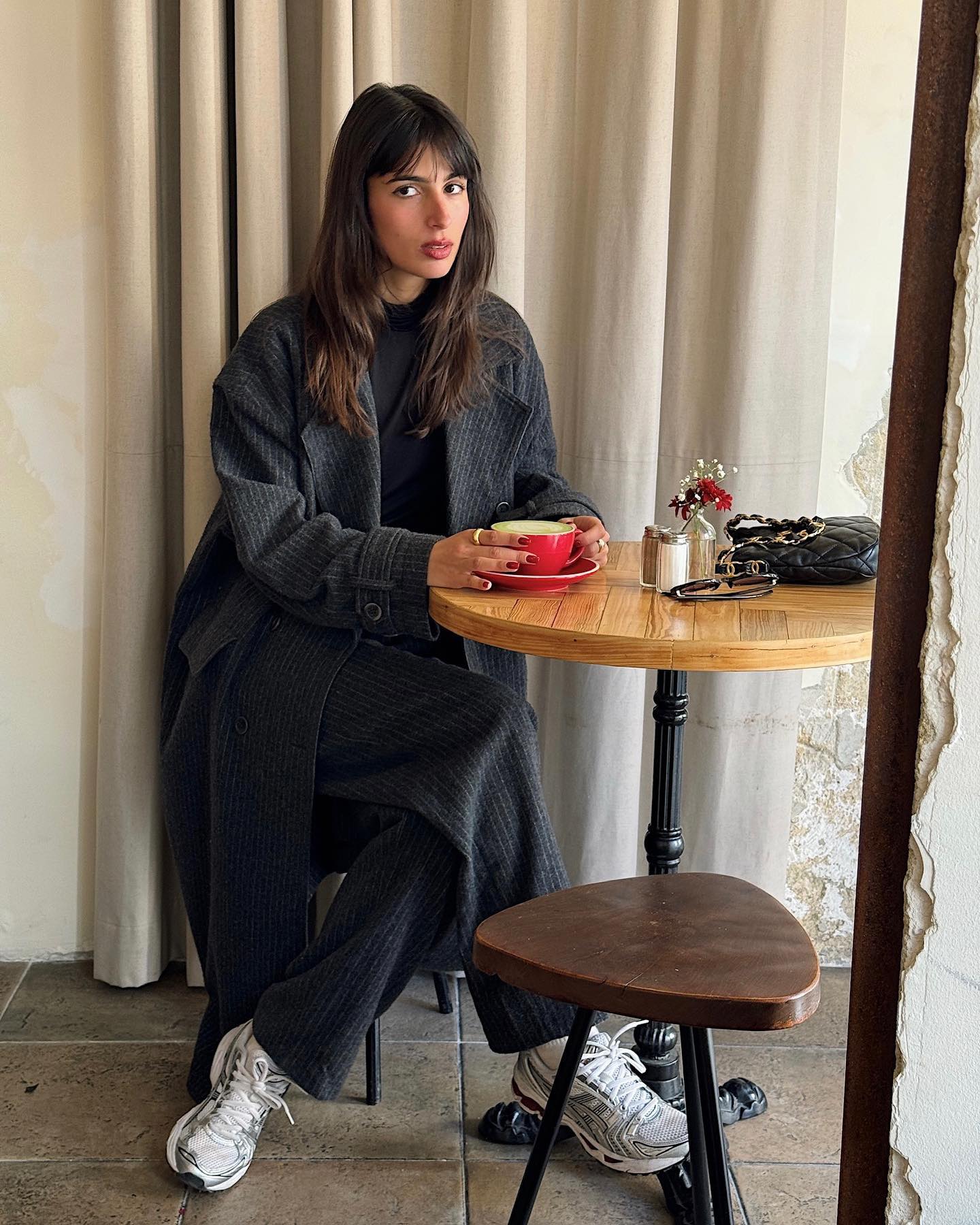 Woman wearing chunky sneakers in Paris