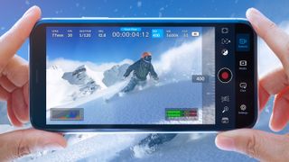 BlackMagic camera app running on an iPhone recording a snowboarder
