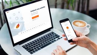 Hola VPN Premium running on a laptop and phone
