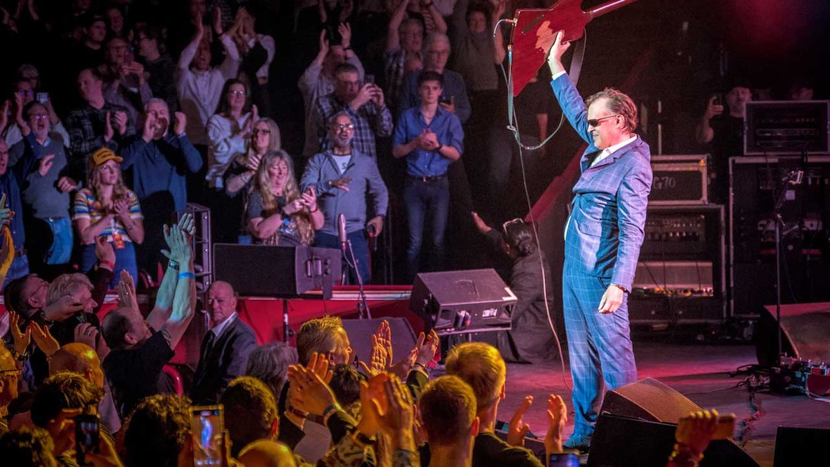 Joe Bonamassa onstage taking a bow