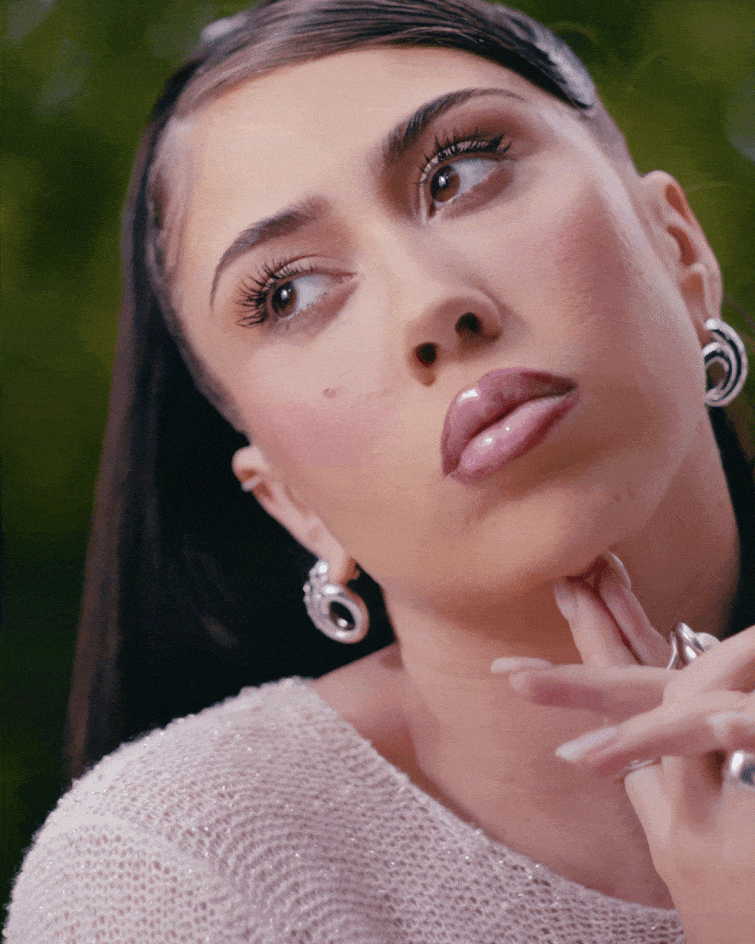 Kali Uchis closing her eyes in a looped gif