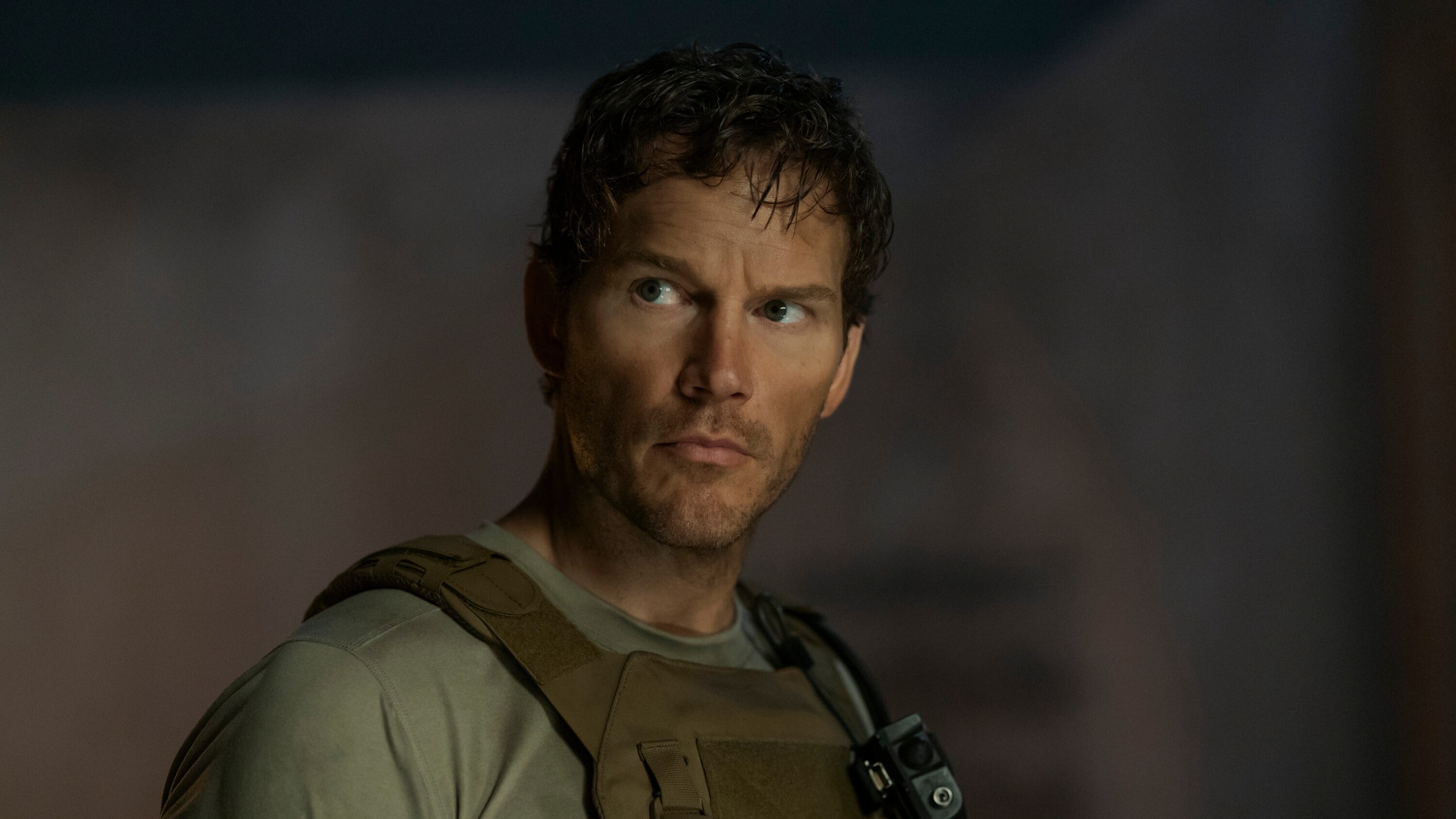Chris Pratt as James Reece wearing a bulletproof vest in The Terminal List season 2.