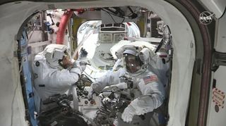 NASA astronauts Chris Cassidy and Bob Behnken prepare to exit the International Space Station for a spacewalk on June 26, 2020.