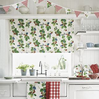 kitchen with white wall and summer strawberry print with sink