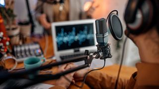 Shot of a podcasting microphone in a studio setting