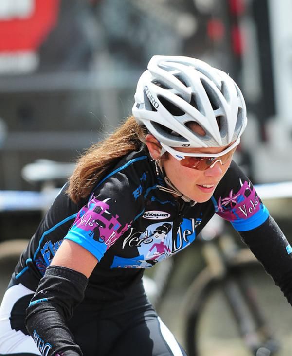 Jenn Tilly (Velo Bella) riding over the line.