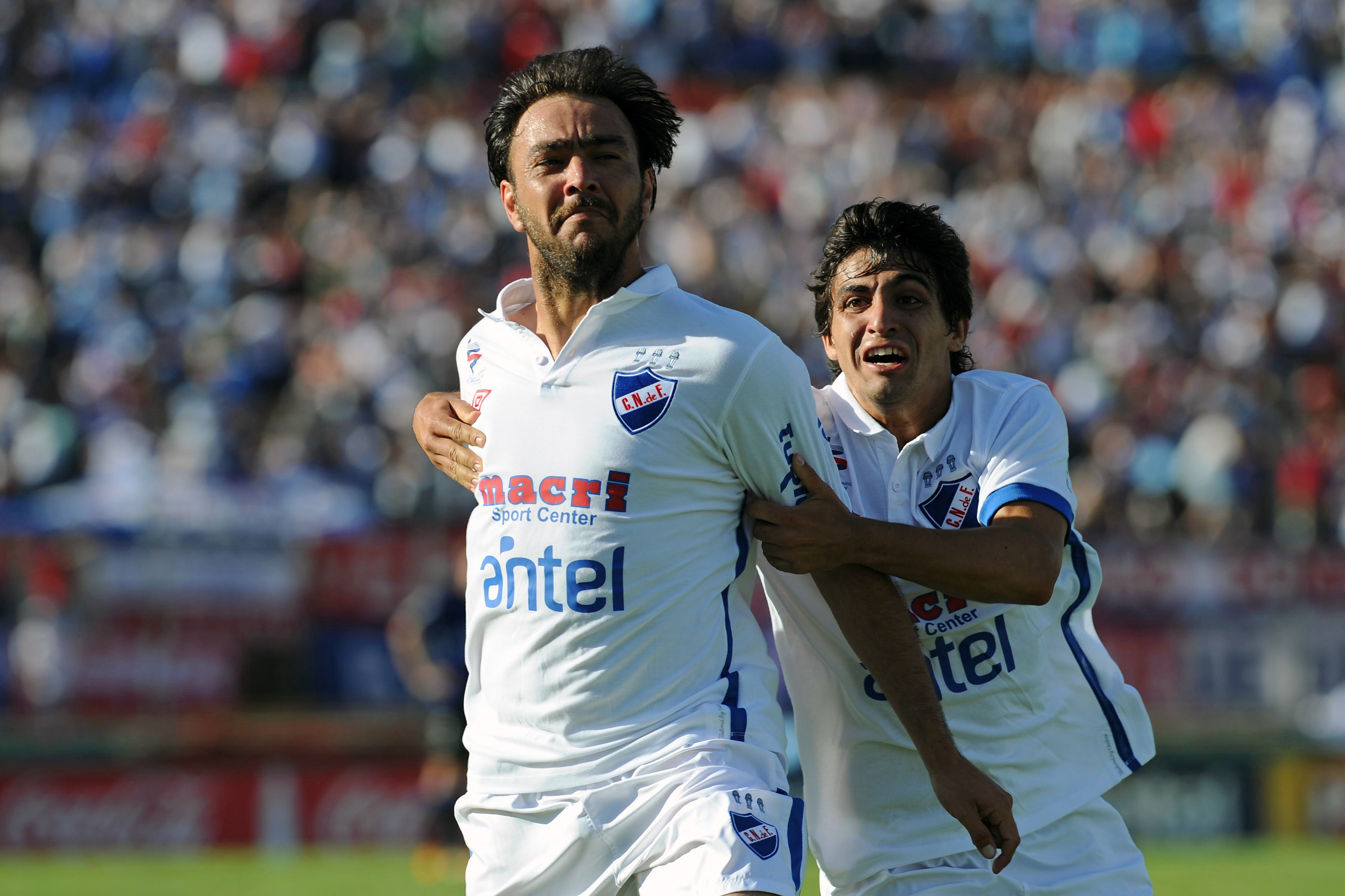 Alvaro Recoba celebrates a goal for Nacional against Liverpool with team-mates Maximiliano Calzada in December 2011.