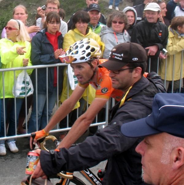 Samuel Sanchez (Euskaltel-Euskadi) gets some help after the finish