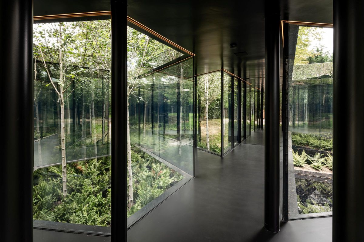 A corridor inside the house with mirrored walls