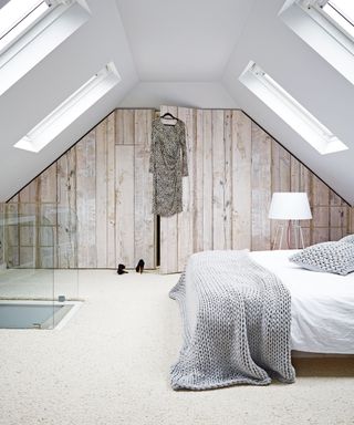 Cozy bedroom ideas with wool carpet and knit throw.
