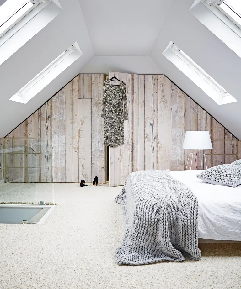 Cozy bedroom ideas with wool carpet and knit throw