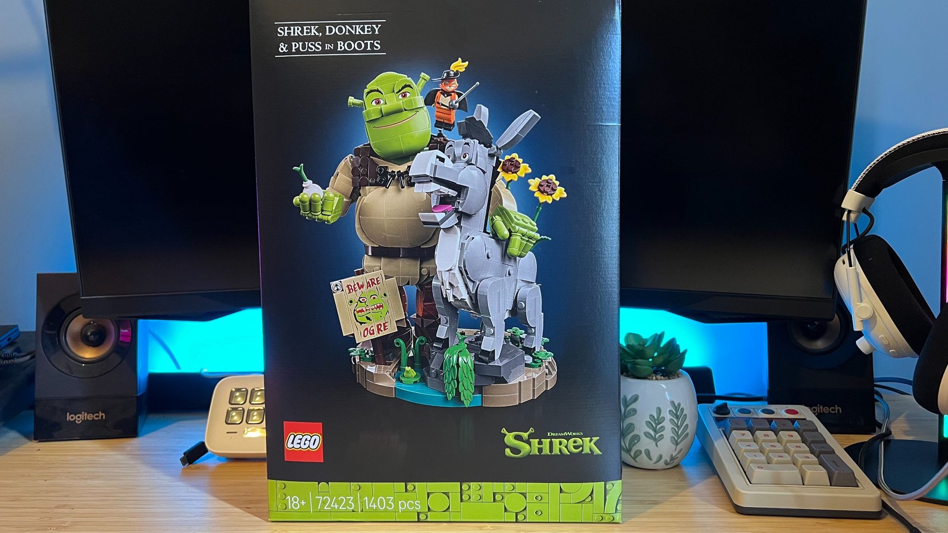 Lego Shrek, Donkey & Puss in Boots set box on a wooden desk