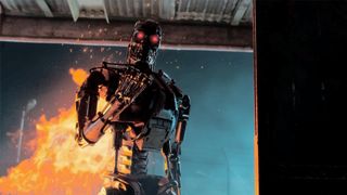 Terminator: Survivors screenshot - T-800 terminator standing in front of fire
