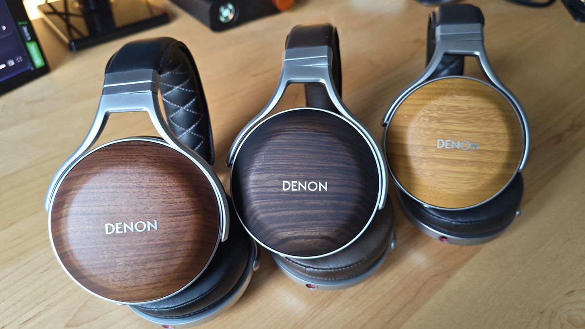 The Denon AH-D5200 and other headphones, photographed on a home desktop.