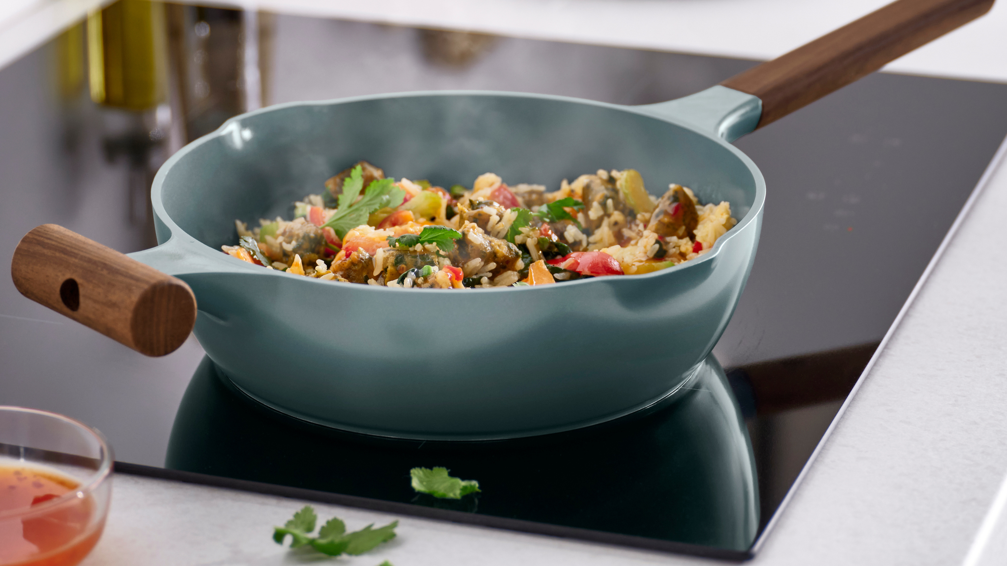 IKEA KLIPPFISK pan filled with rice on an induction hob.