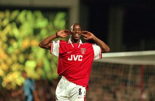 Ian Wright celebrates a goal for Arsenal against West Ham in 1997.