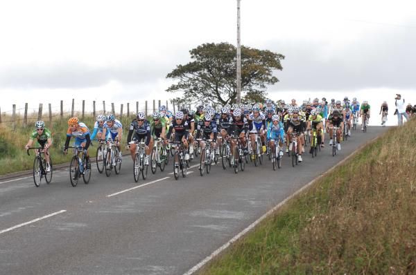 The main peloton rolls along