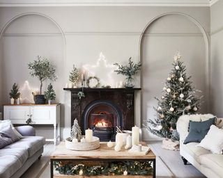 Christmas tree in a festive living room decorated with neutral decor
