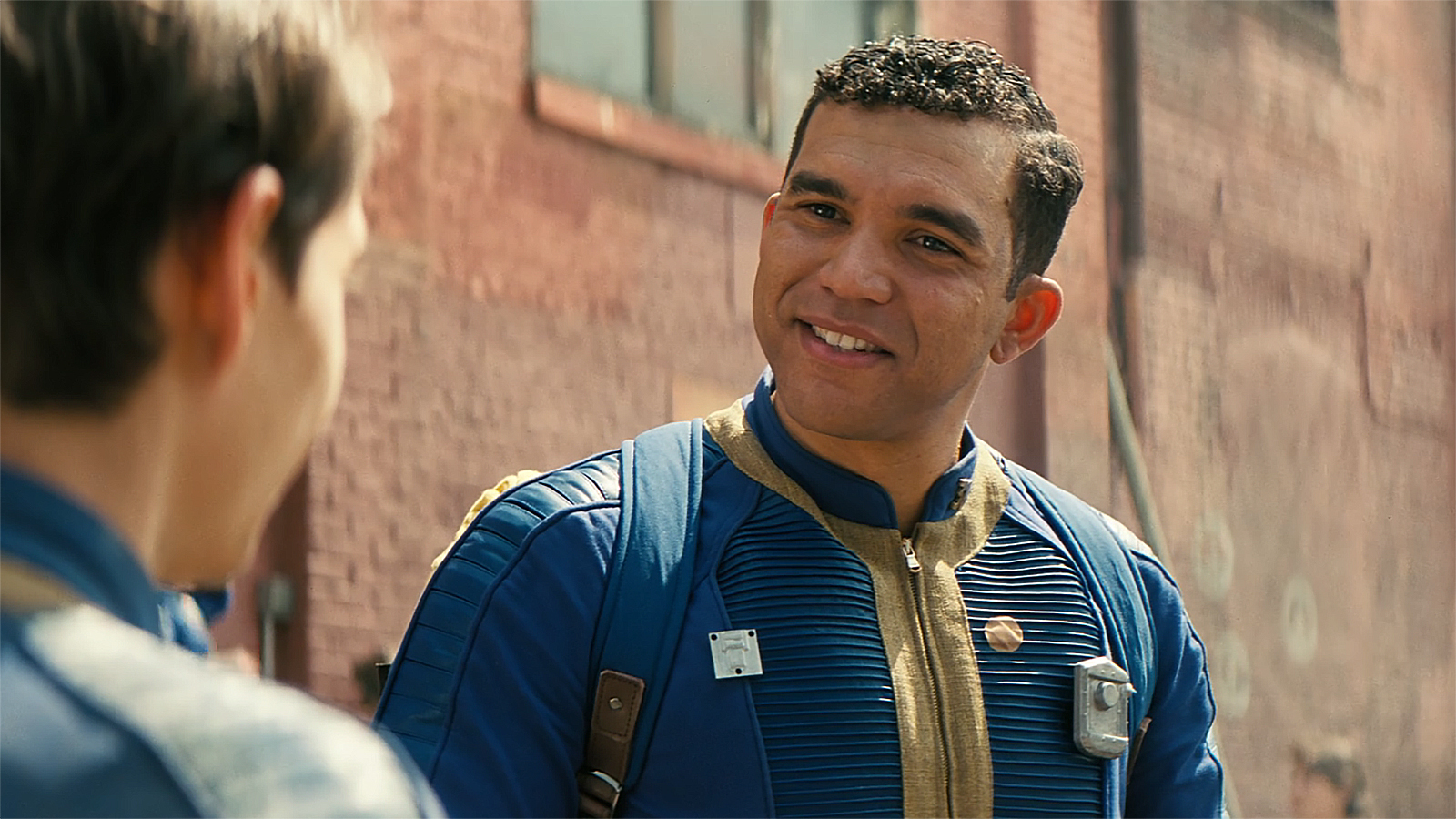 Ronnie staring and smiling at Norm in Fallout season 2 episode 4