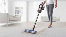 The best prime day vacuum deals: a dyson outsize vacuuming on a carpet