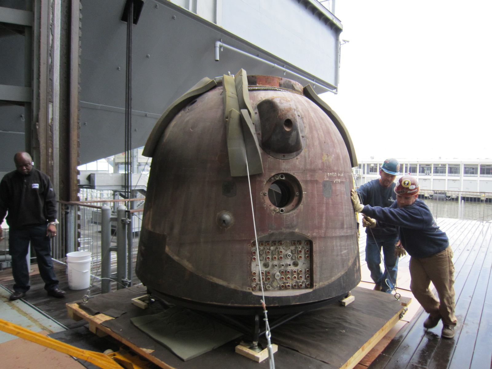 Workers at New York City&#039;s Intrepid Sea, Air and Space Museum wheel the Soyuz TMA-6 spacecraft into the museum on Oct. 18, 2011. The capsule is on loan and will become the latest addition to the Intrepid&#039;s outer space exhibit.