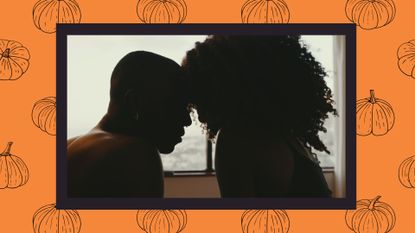 a couple&#039;s silhouette in bed on a background of orange and black pumpkins