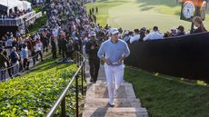 Patrick Cantlay walks up the stairs above the 18th green during round two of the 2024 Genesis Invitational