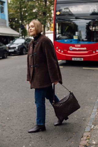 Woman wears Marks & Spencer Textured Buckle Coat