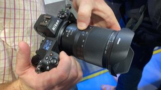 Nikon Z 17-28mm f/2.8 held in hands