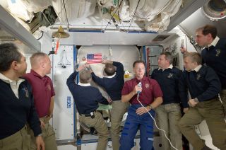 The STS-1 and STS-135 American flag was originally affixed to the forward-facing hatch in the space station's Harmony node.