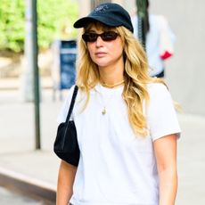 Jennifer Lawrence wore the toe ring sandal trend with low-rise jeans and a white T-shirt in NYC