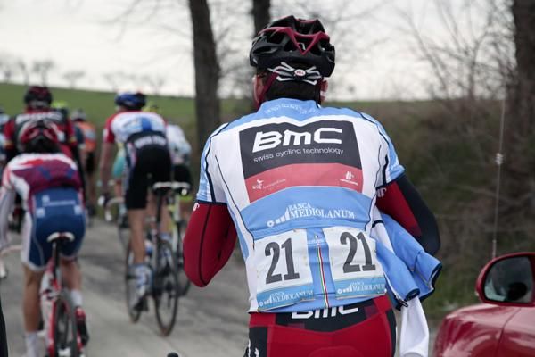 Cadel Evans (BMC) drops off a jacket at the team car.