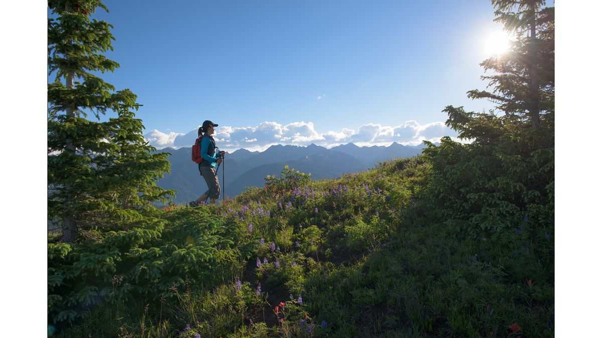 A woman hiking on Vail mountain