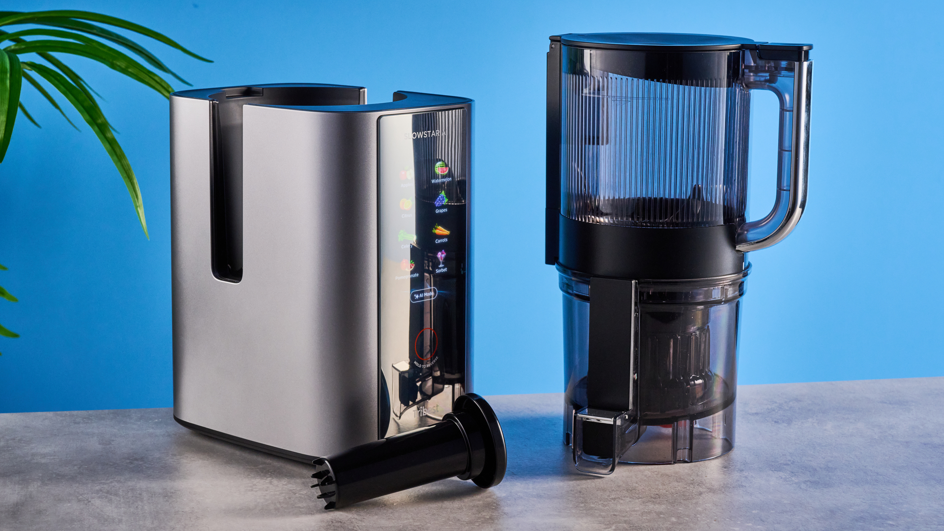 Tribest Slowstar AI Vertical Hopper Juicer photographed in front of a blue background