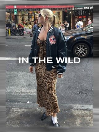 @nataliegreyherder wearing leopard print dress, varsity jacket, and loafers.