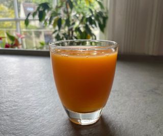 A glass of juice made in the Nama J3 Juicer