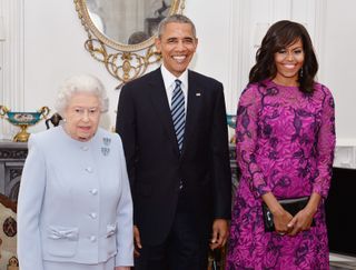 Queen Elizabeth II (L) stands with US President Barack Obama and First Lady of the United States, Michelle Obama in the Oak Room at Windsor Castle ahead of a private lunch hosted by the Queen on April 22, 2016 in Windsor, England.