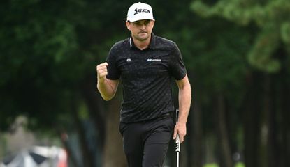 Bradley fist pumps after holing a birdie putt