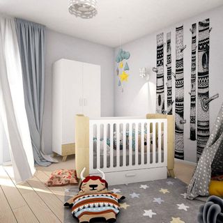 white nursery with plywood flooring and cupboard