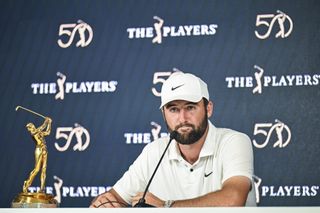 Scottie Scheffler poses with The Players Championship trophy