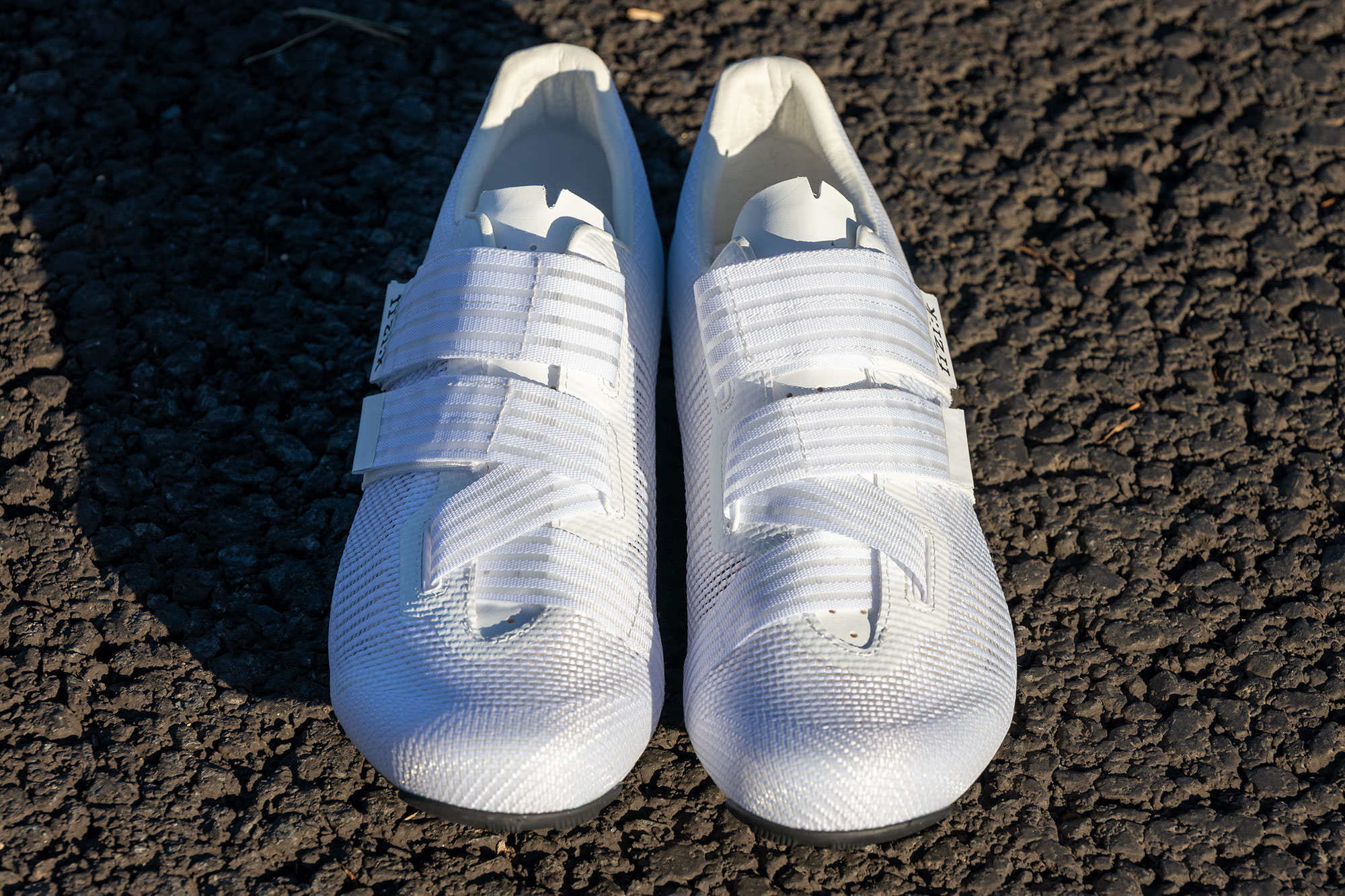 Fizik Powerstrap Aeroweave shoes on a tarmac road, pictured front on