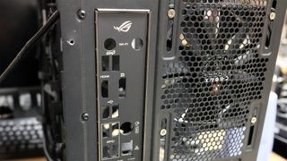 Picture showing the back panel of a PC case with a fan