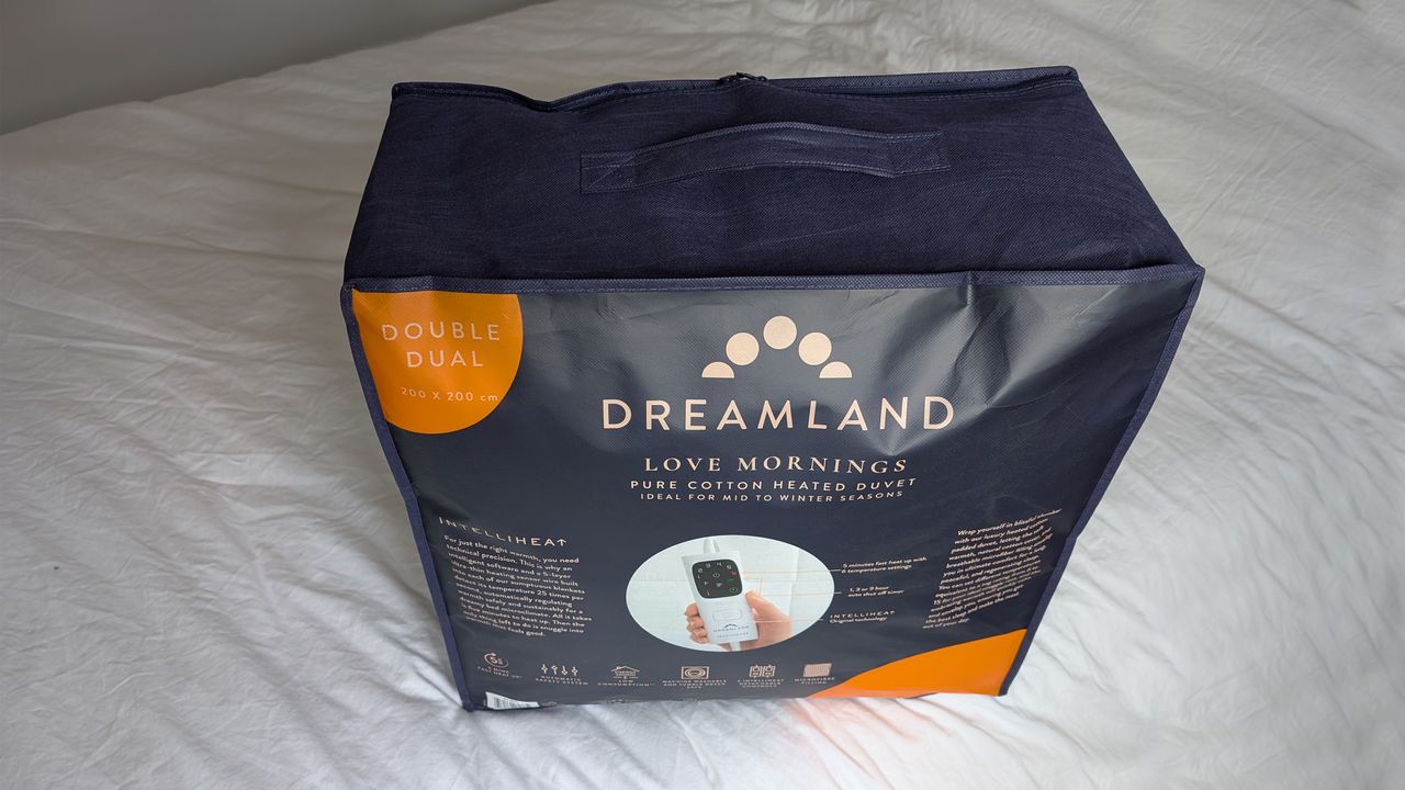 The Dreamland Love Mornings All Season Pure Cotton Heated Duvet on a bed