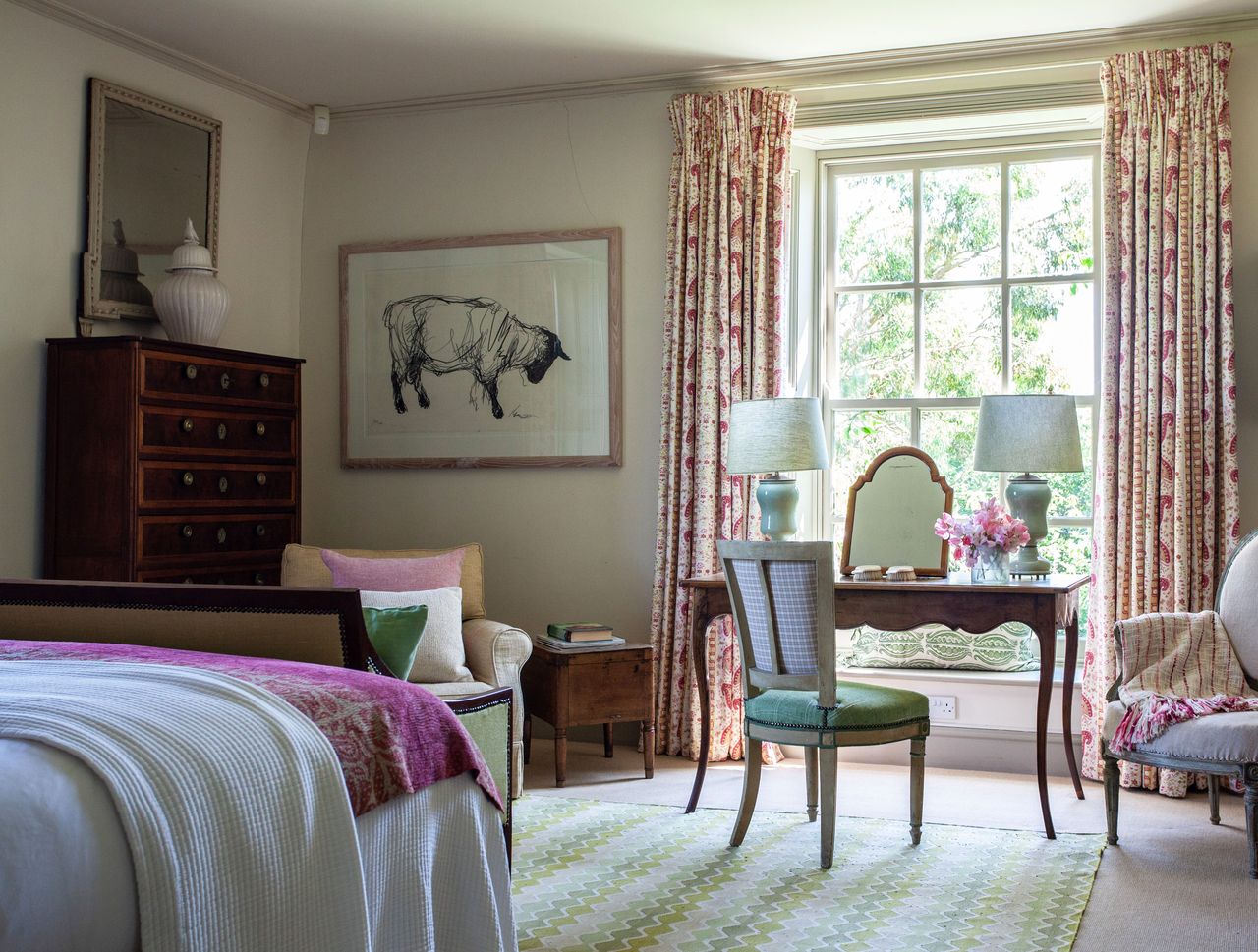 Wooden chest of draws and desk, green carpet